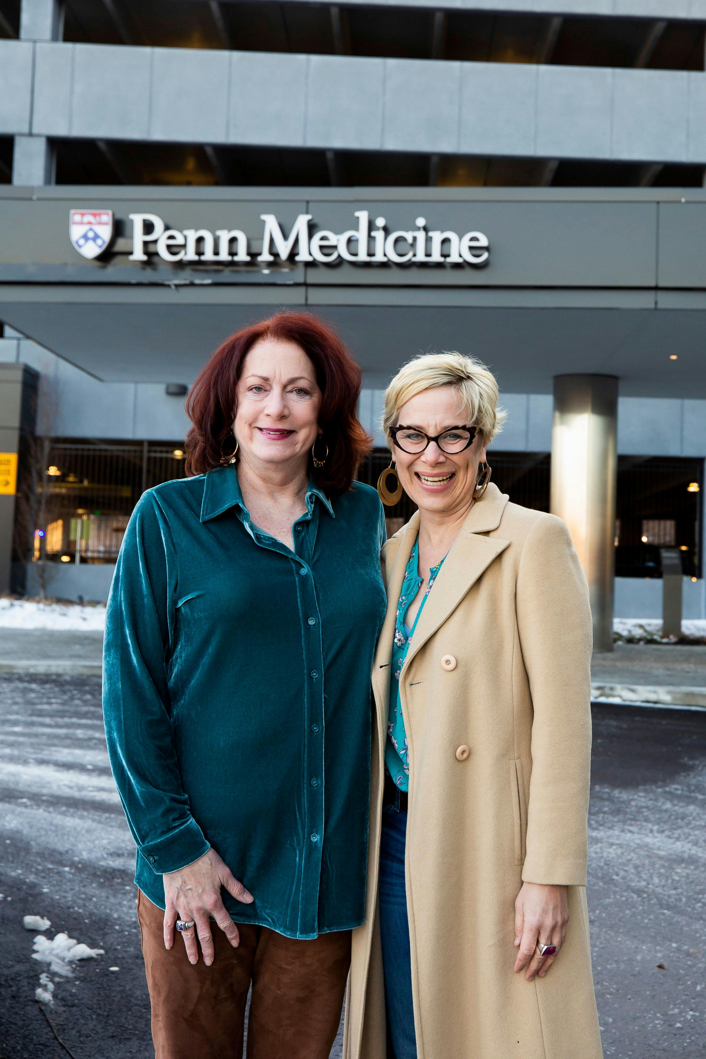 Lorelei Graham (left), CRNP, stands with Jenny Burkholder outside Penn Medicine in Philadelphia.