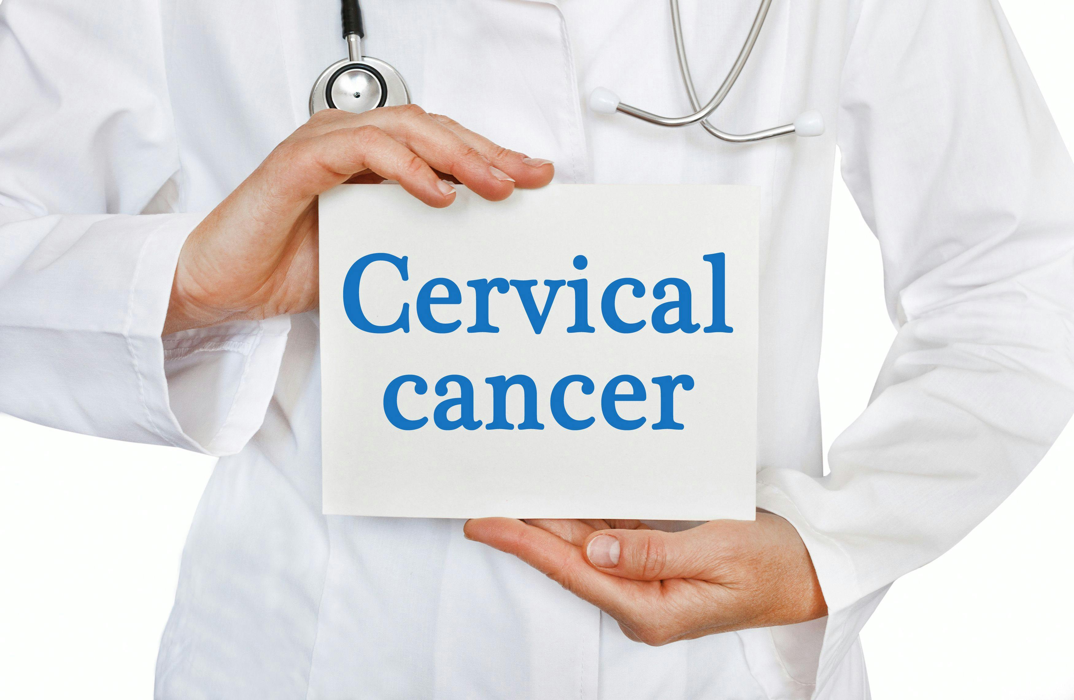 Image of a doctor holding a sign that says "cervical cancer."